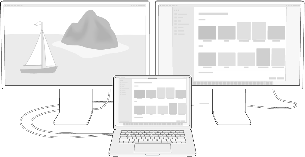 A MacBook Air next to two Studio Displays used as external displays.