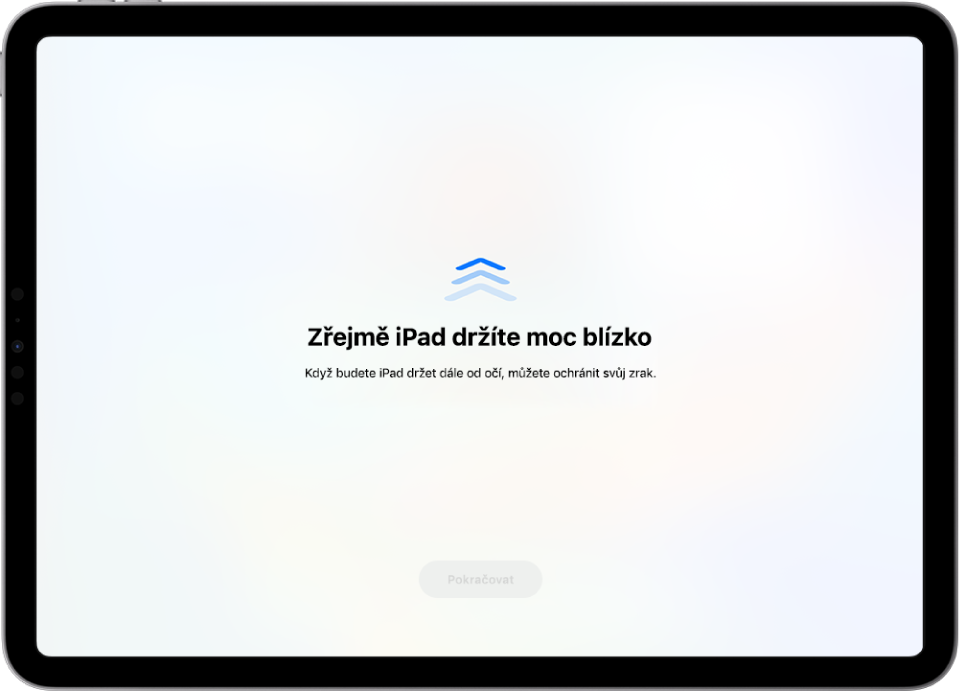 Obrazovka s varováním, že iPad je příliš blízko a že jeho doporučená vzdálenost od očí je zhruba na vzdálenost paže. Jakmile se iPad oddálí, objeví se dole na obrazovce tlačítko Pokračovat, které umožňuje návrat na předchozí obrazovku